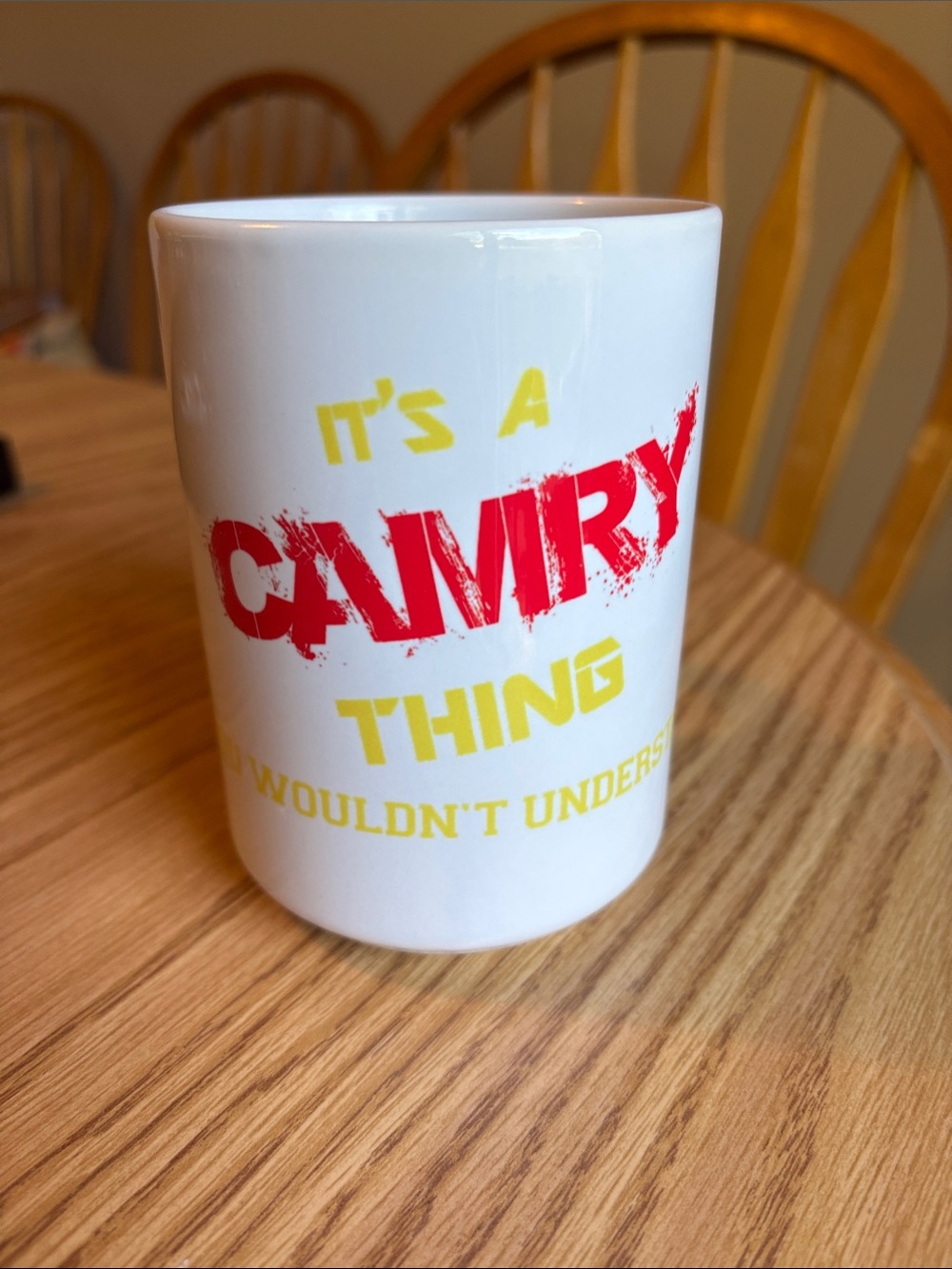 White Ceramic Mug with Bold Red and Yellow 'Camry' Graphic